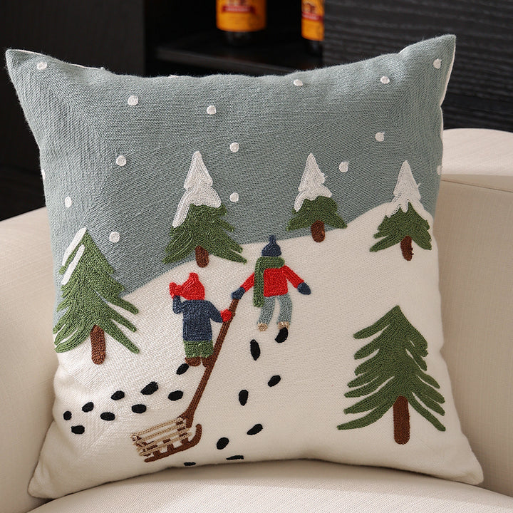 Hand-stitched winter decorative sofa cushion with sled and fir motif