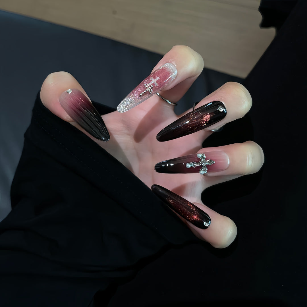 Glamorous artificial nails with shimmering color gradient and cross design Stornfield