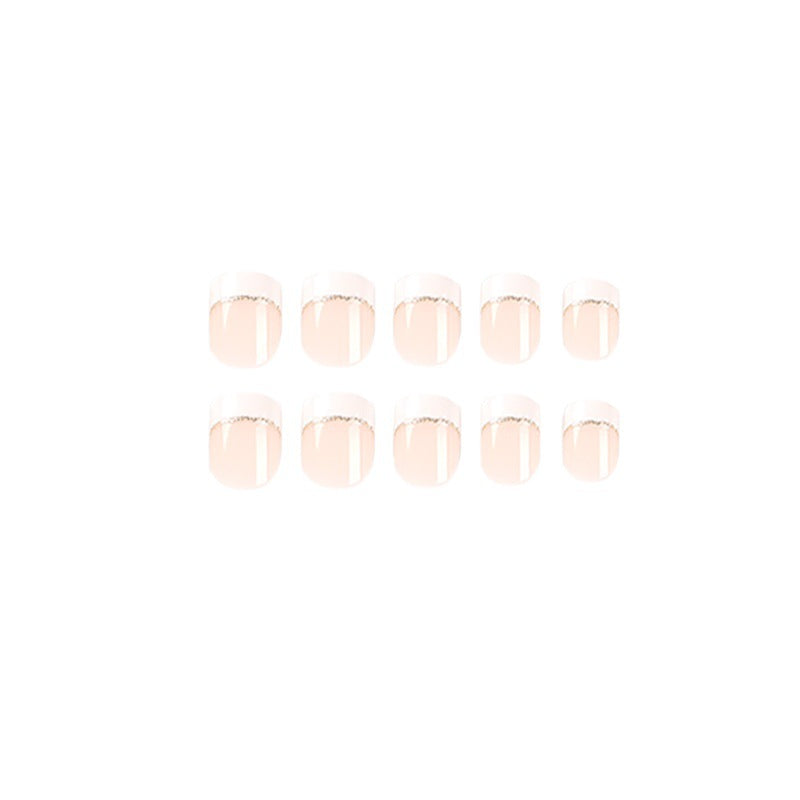 Artful nail extensions with elegant French tip and gold accents Stornfield