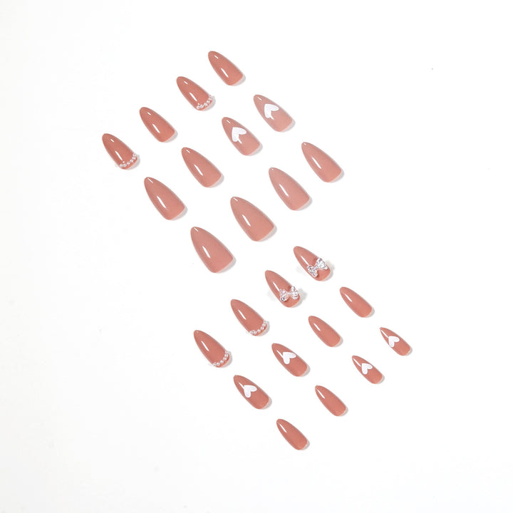 Elegant artificial nails with heart-shaped and glitter accents Stornfield