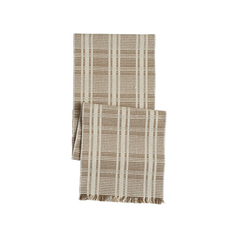Woven table runner with contrasting center stripe, textured waffle look and decorative fringes