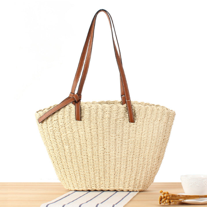 Beach bag made of handwoven natural material with sturdy leather straps Stornfield