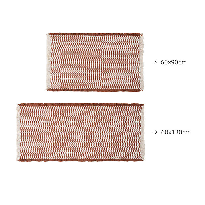 Handwoven cotton bath mat with herringbone pattern and fringes Stornfield