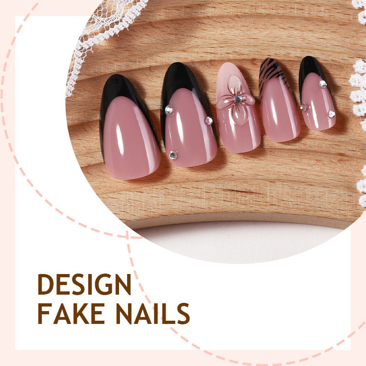 Acrylic nail set with elegant glitter and flower accents Stornfield