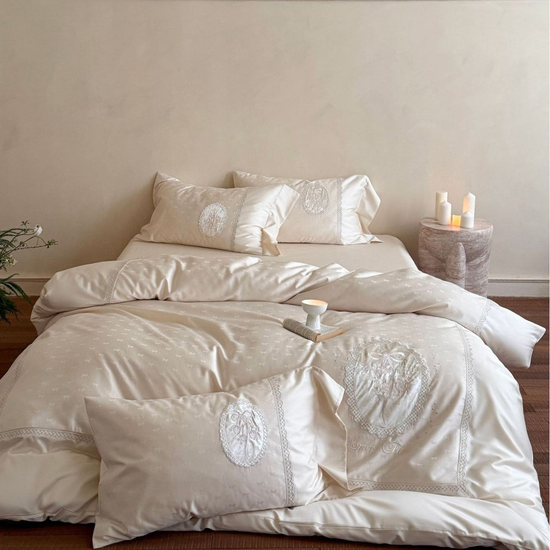 Luxurious cotton satin bedding set with embroidered medallion appliqués and lace trim