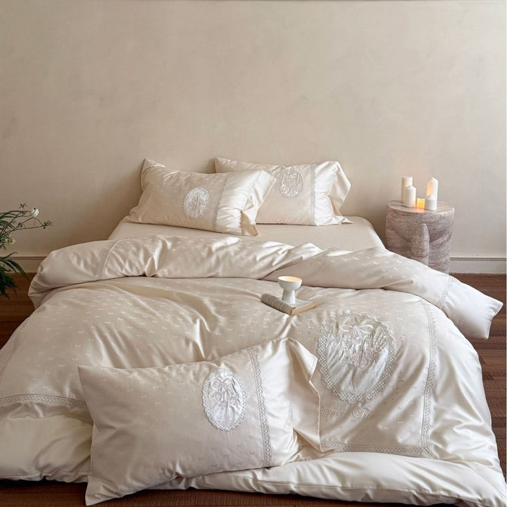 Luxurious cotton satin bedding set with embroidered medallion appliqués and lace trim