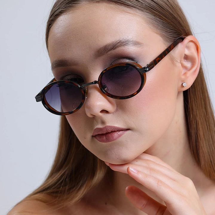 Women's round sunglasses with lightweight lenses and gold accents Stornfield