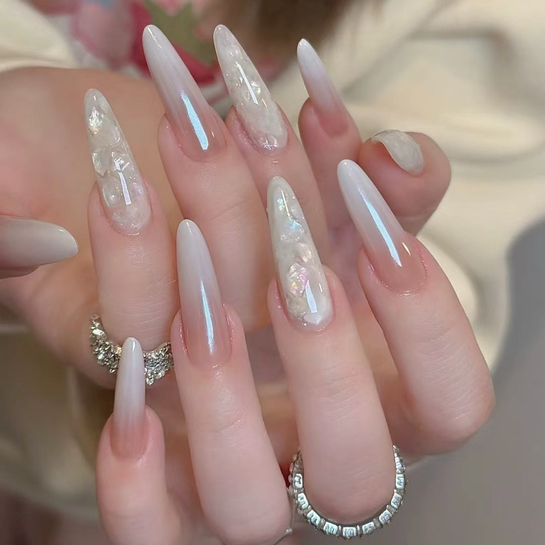 Glamorous Stiletto Nail Extensions with Decorative Accents