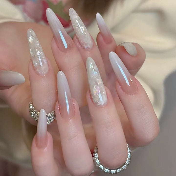 Glamorous Stiletto Nail Extensions with Decorative Accents