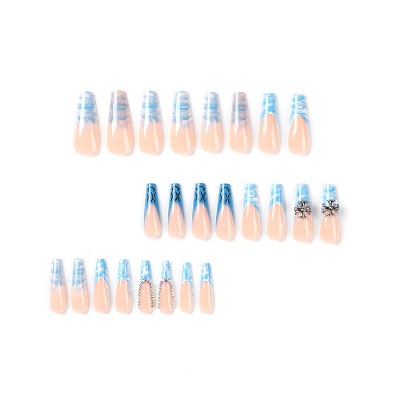 Artistic acrylic nails with marbled design and unique embellishments Stornfield