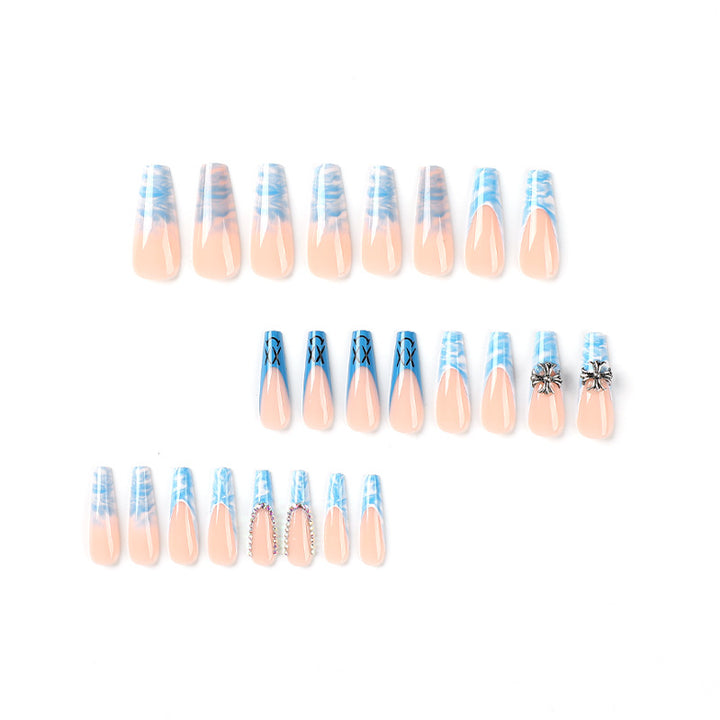 Artistic acrylic nails with marbled design and unique embellishments Stornfield