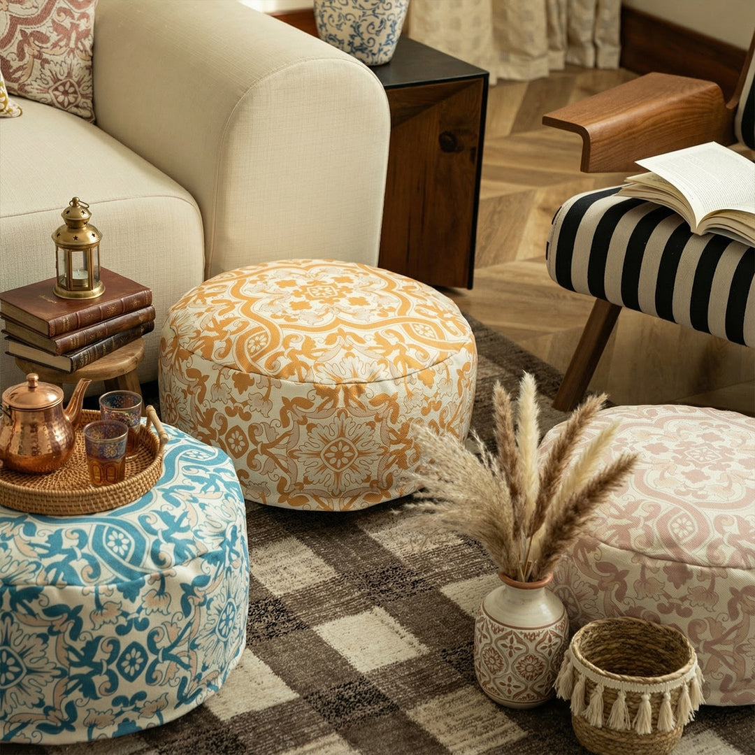 Round floor pouf with woven ornament pattern and carrying handle Stornfield