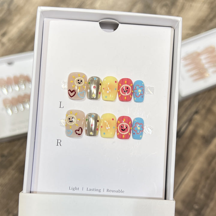 Whimsical Press-On Nail Art Set with Smiley Faces and Floral Designs Stornfield