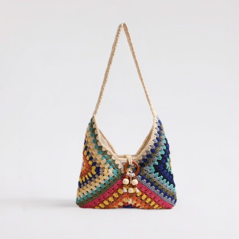 Handmade macrame shoulder bag with playful pendant Stornfield