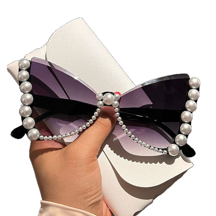 Women striking sunglasses with pearl decoration Stornfield