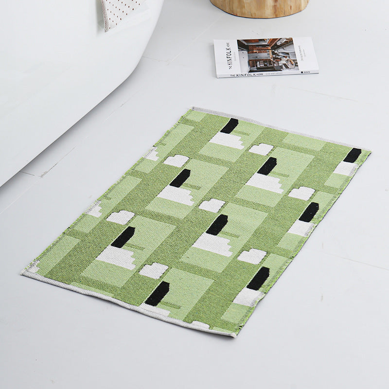 Modern geometric bathroom rug made of flat-woven cotton with non-slip backing Stornfield