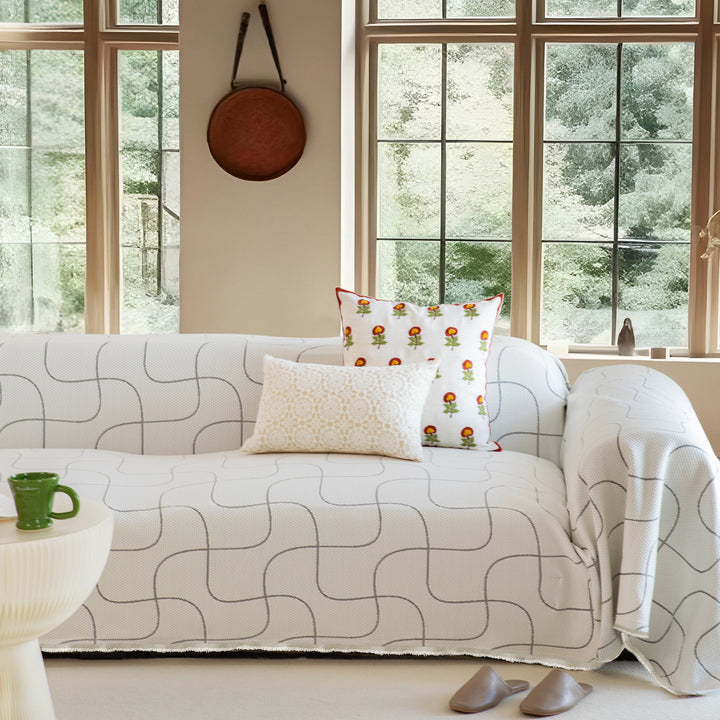 Washable sofa cover with geometric jacquard pattern and non-slip underside