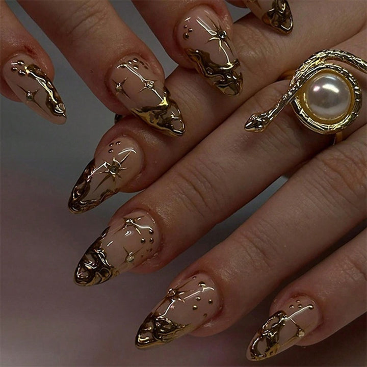 Creative nail set with elegant gold embellishments and sparkling accents Stornfield