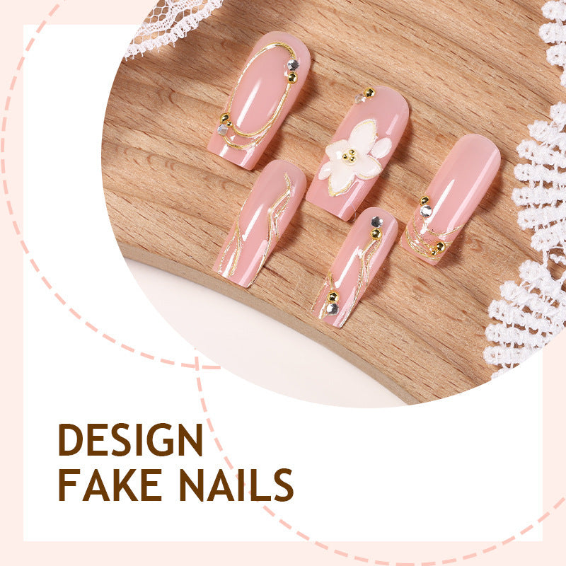 Artificial nail set with floral embellishments and gold accents Stornfield