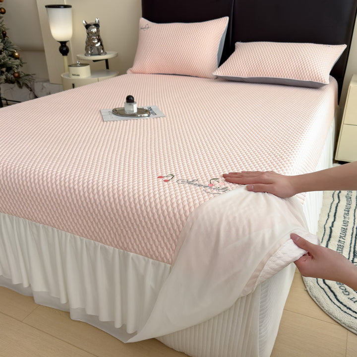 Quilted mattress protector with elastic all-around fit and panda embroidery
