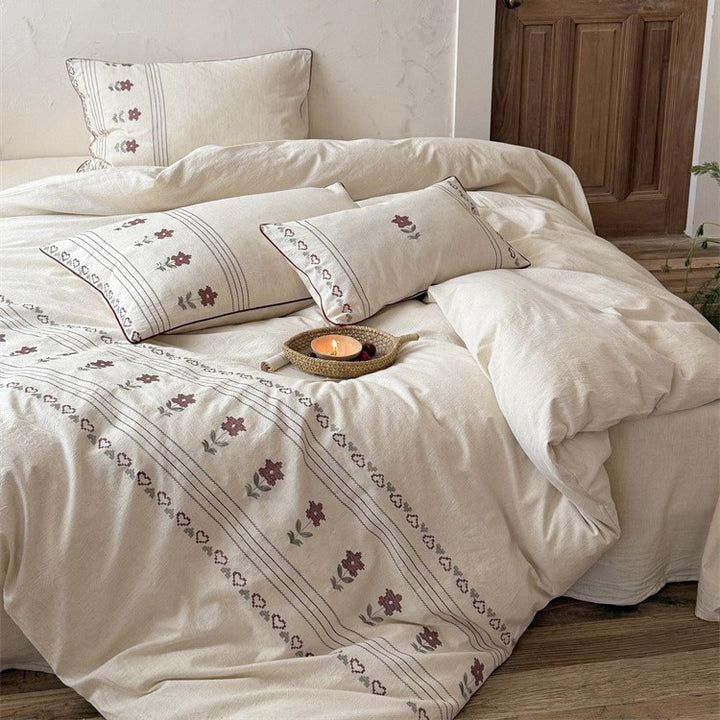 Cotton-linen bedding set with embroidered floral border decor Stornfield
