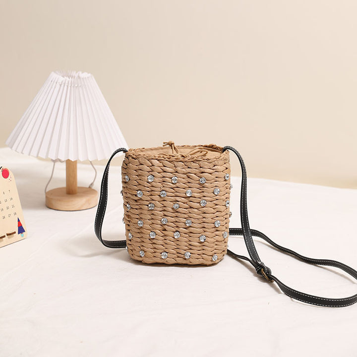 Bag made of woven natural material with sparkling appliqués Stornfield