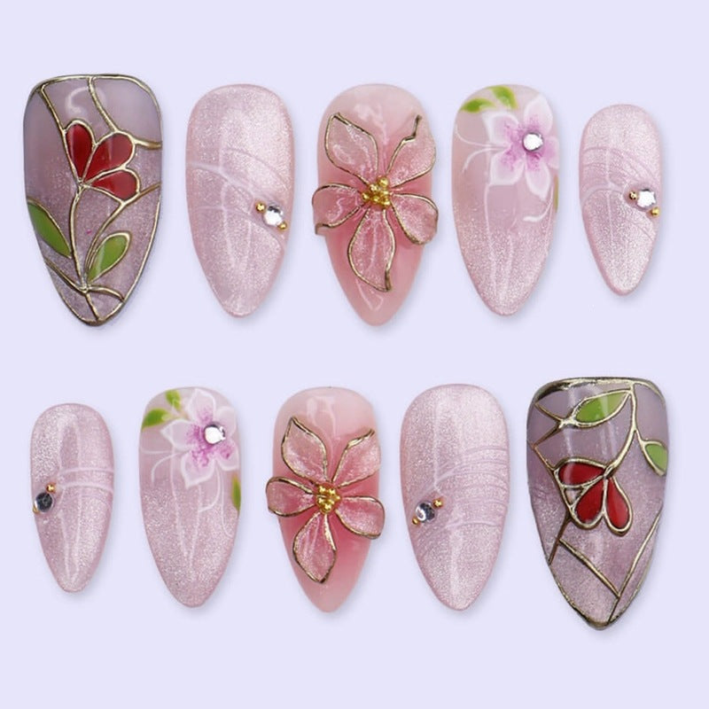 Artificial nail set with luxurious floral designs and glitter accents Stornfield