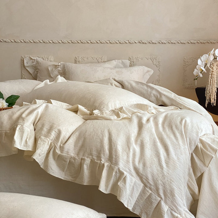 Jacquard bedding set with decorative ruffle border and floral relief
