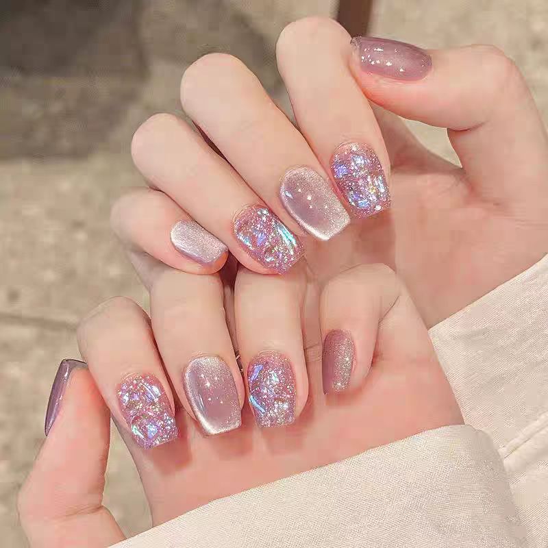 Artificial nails with sparkling glitter and holographic effect Stornfield