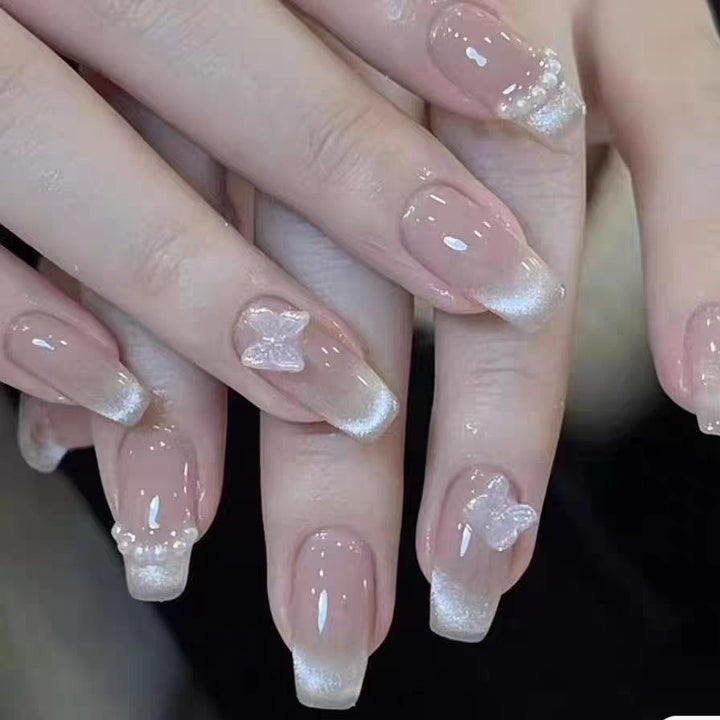 Artificial nails with elegant butterfly accents and glittering coating Stornfield