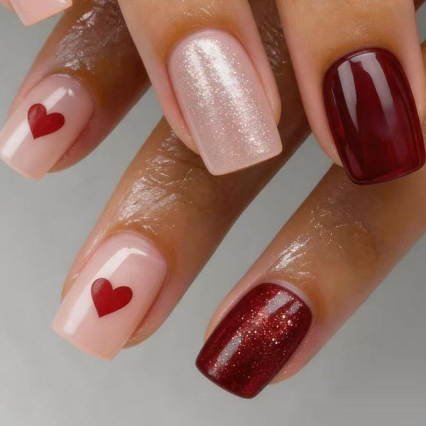 Art nail set with heart designs and glitter Stornfield