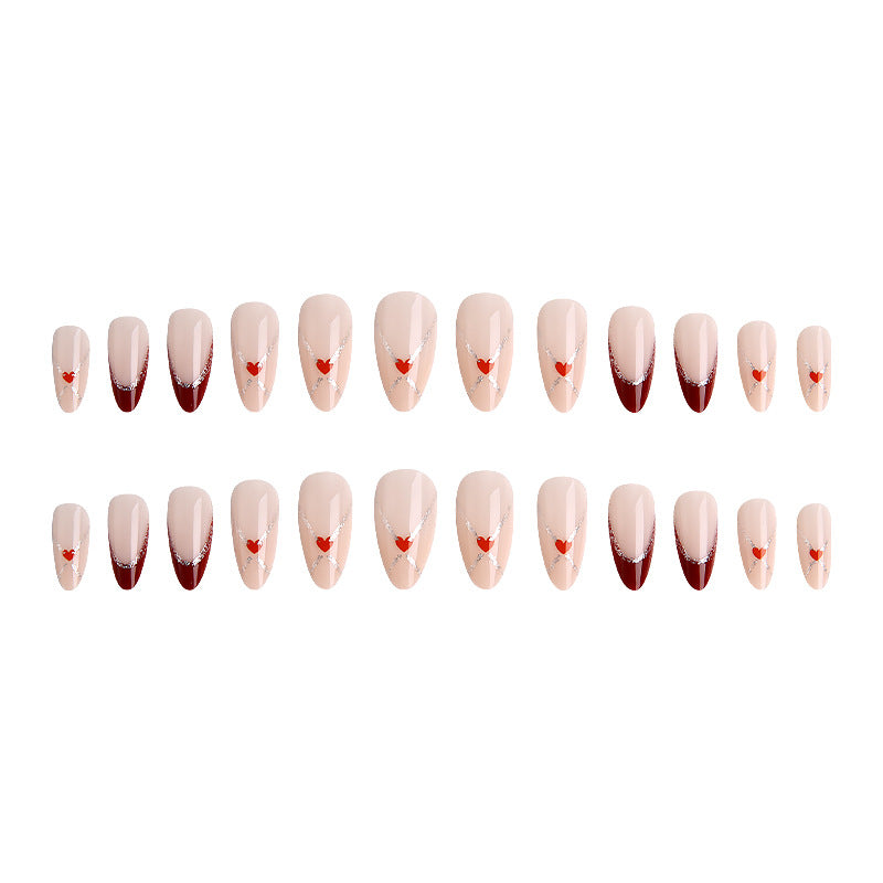 Acrylic nails with heart motifs and glitter details Stornfield