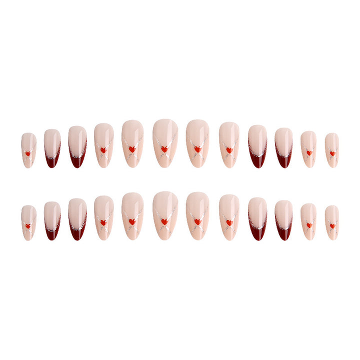 Acrylic nails with heart motifs and glitter details Stornfield