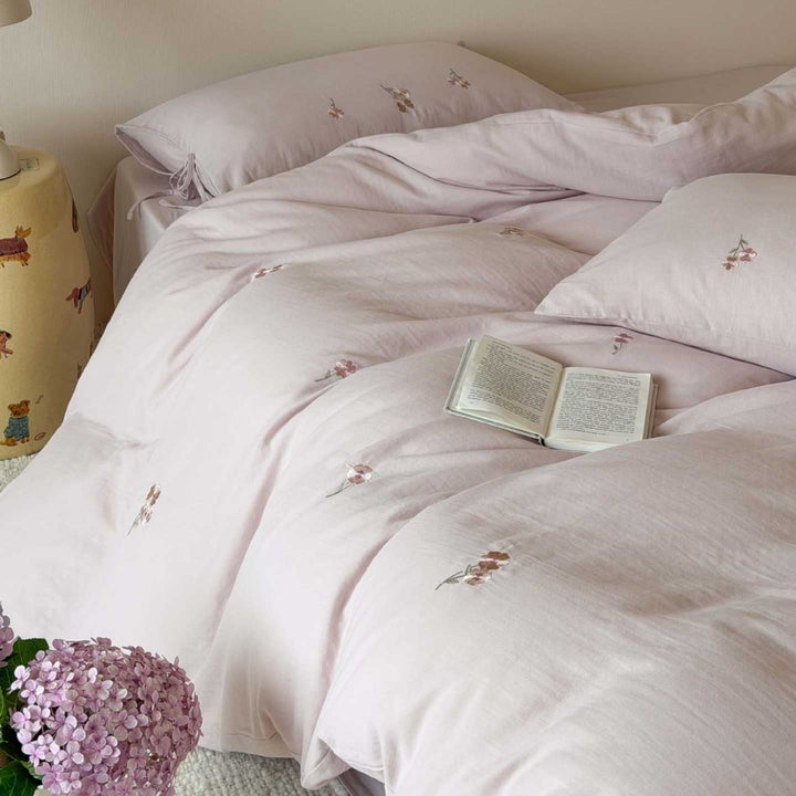 Breathable cotton bedding set with delicate flower embroidery and tie ribbon pillow
