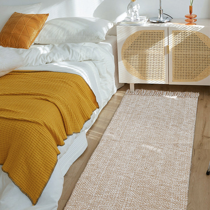 Woven table runner made of cotton blend with fine structure and herringbone look as well as decorative fringes Stornfield
