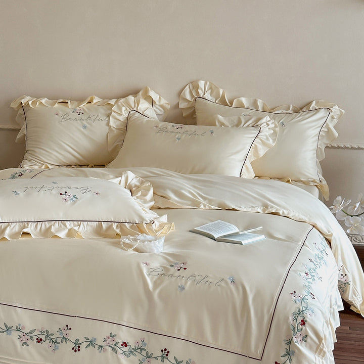 Luxurious bedding set with ruffled hem and floral embroidery