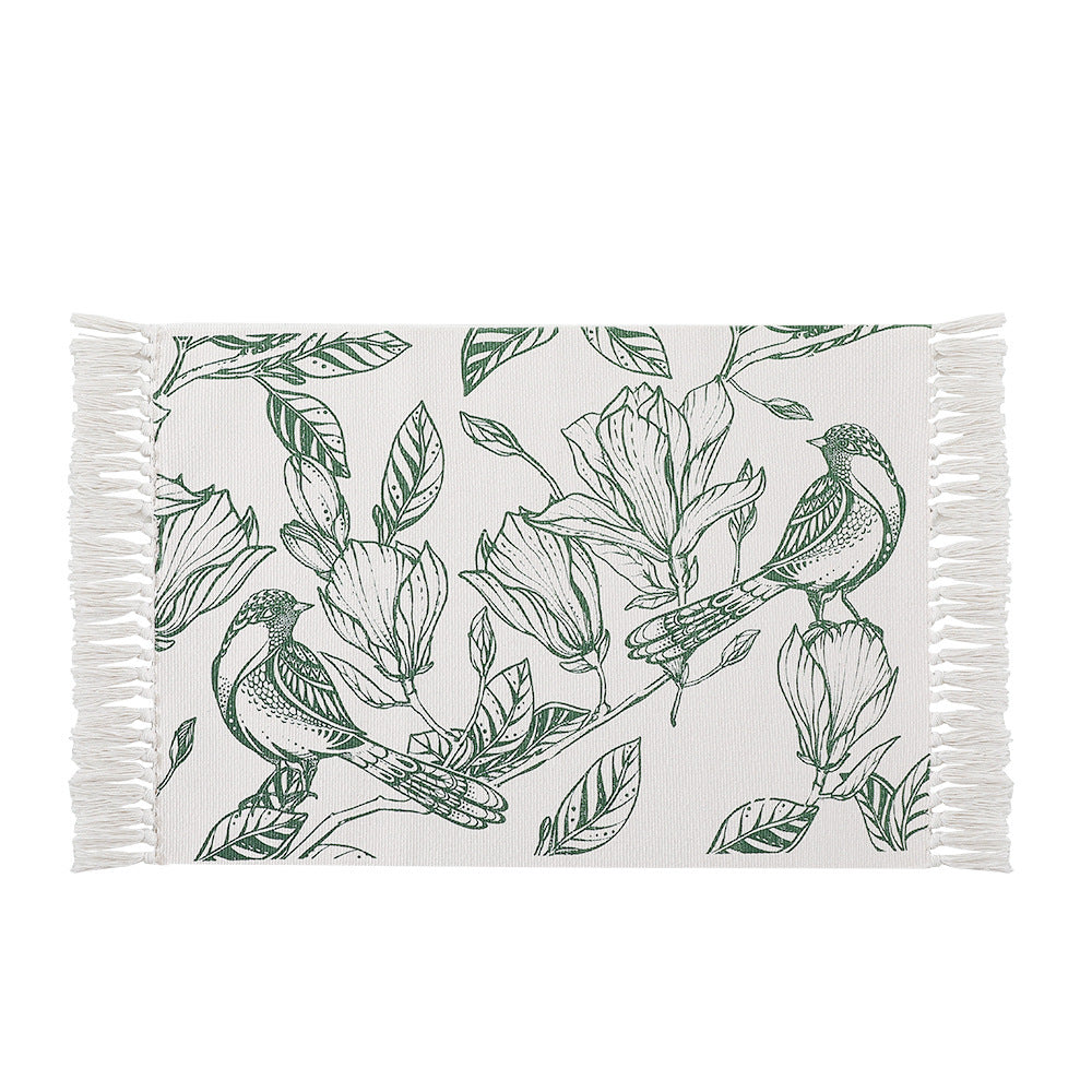 Woven table runner with botanical bird print and decorative fringes