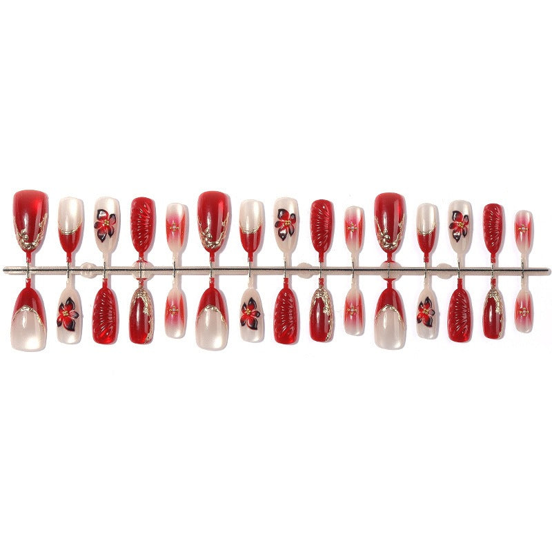 Acrylic nail set with floral design and elegant glitter details Stornfield