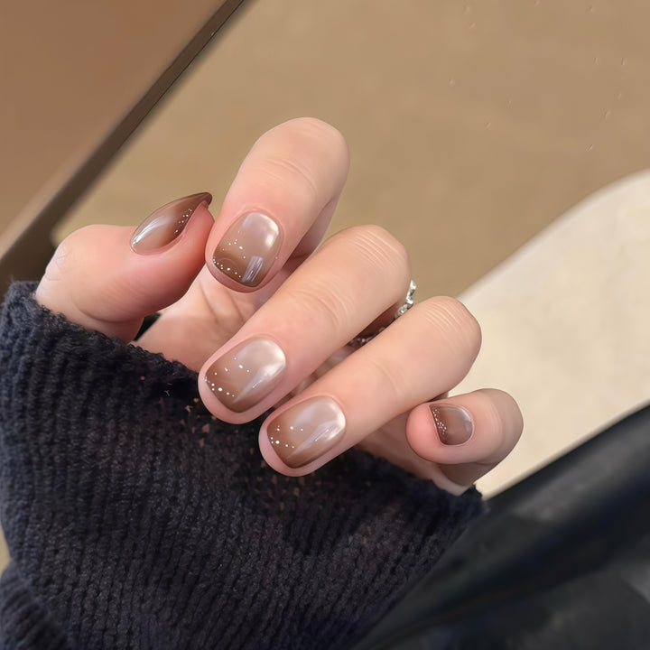 Artificial nails with elegant gradient color and glitter elements Stornfield