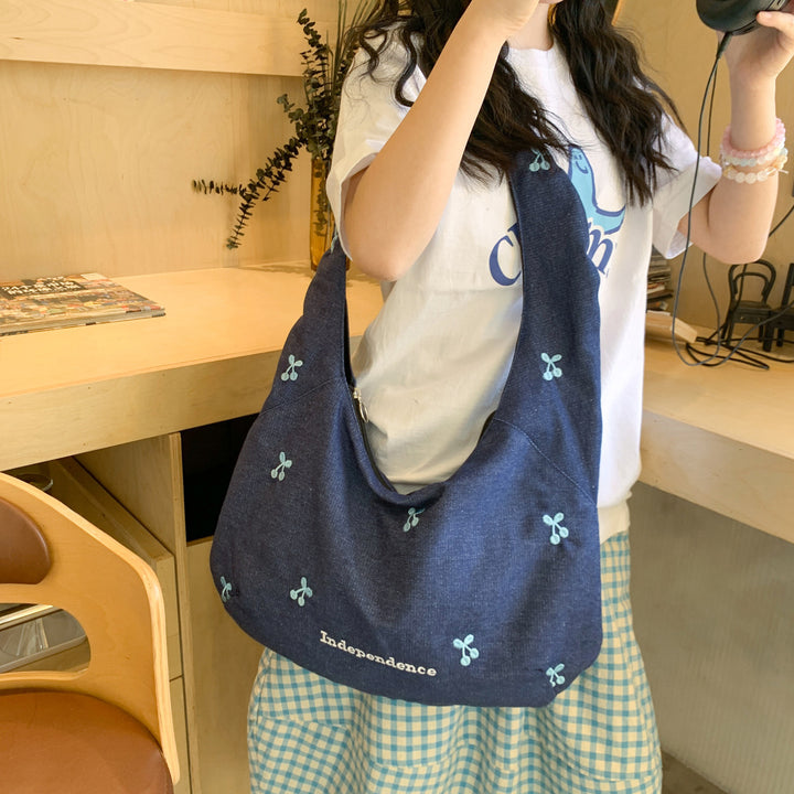 Comfortable shoulder bag with original embroidery motif Stornfield