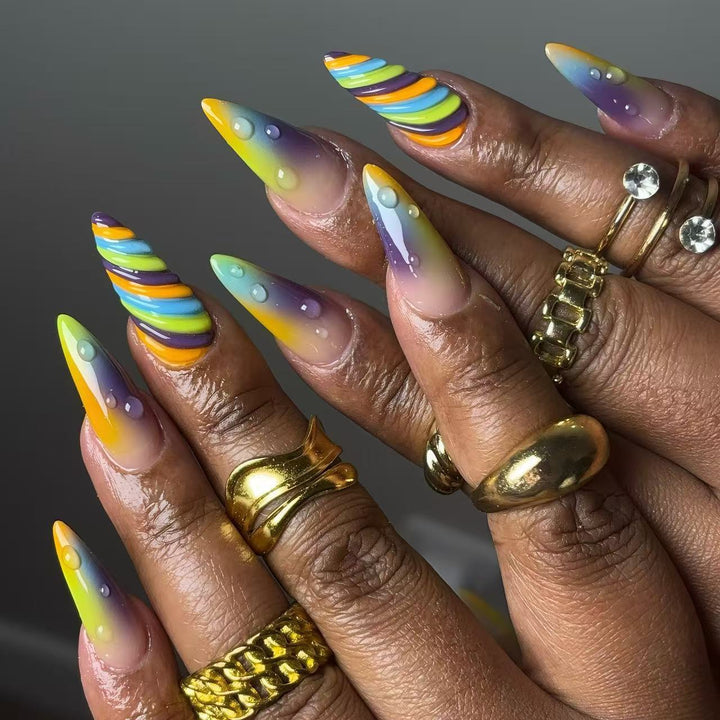 Artificial nails with soft ombre colors and creative patterns Stornfield