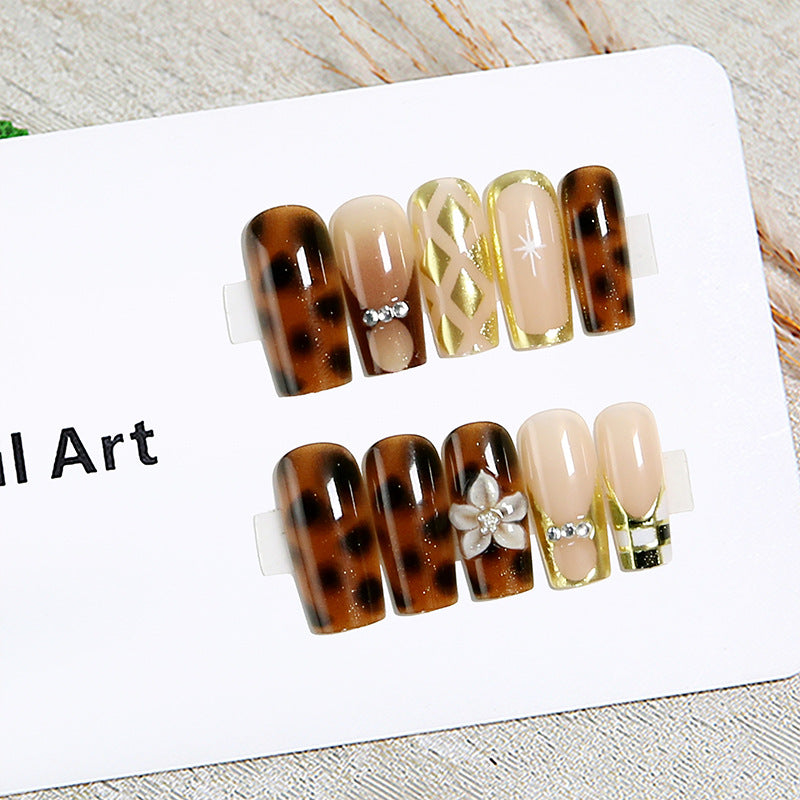 Elegant artificial nails with floral and glittering details Stornfield