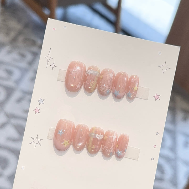 Artificial nails with romantic star and glitter motifs Stornfield