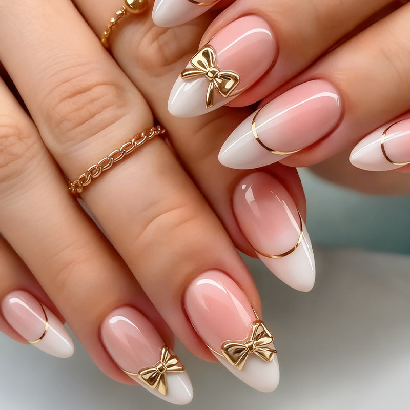 Artificial nail set with elegant gold edge and decorative accents Stornfield
