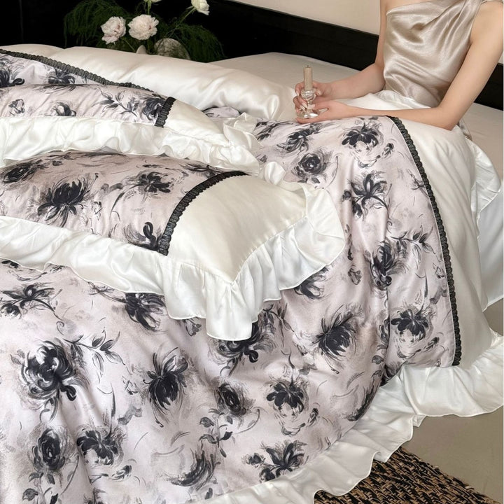 Elegant bedding set made of high-quality cotton satin with ruffles, delicate lace trim, and watercolor floral print