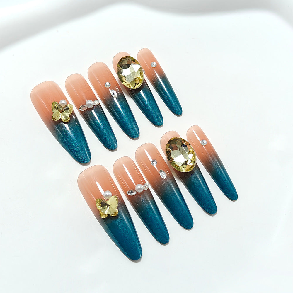 Glamorous artificial nails with elegant ombre effect and high-quality embellishments Stornfield