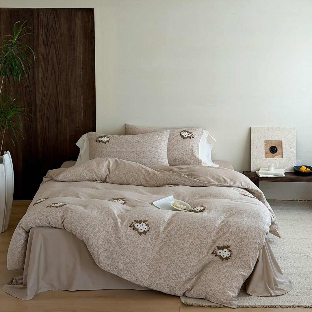 Embroidered bed set made of fine cotton satin with gathered bed skirt and decorative pillows