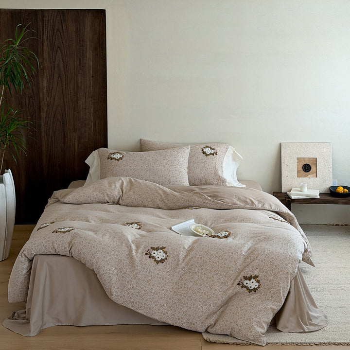 Embroidered bed set made of fine cotton satin with gathered bed skirt and decorative pillows