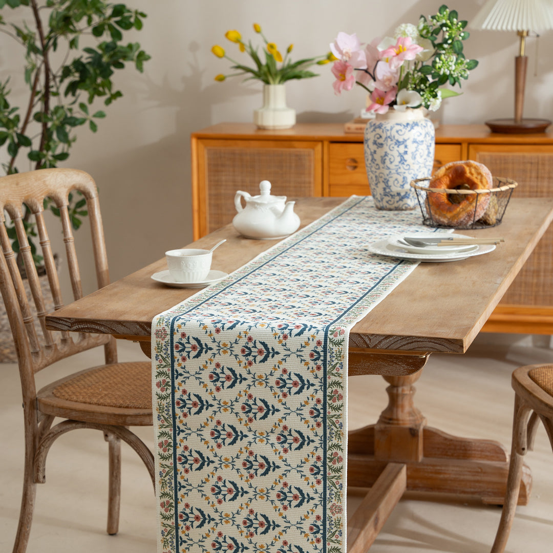 Woven runner with vintage-oriental floral pattern and fringes