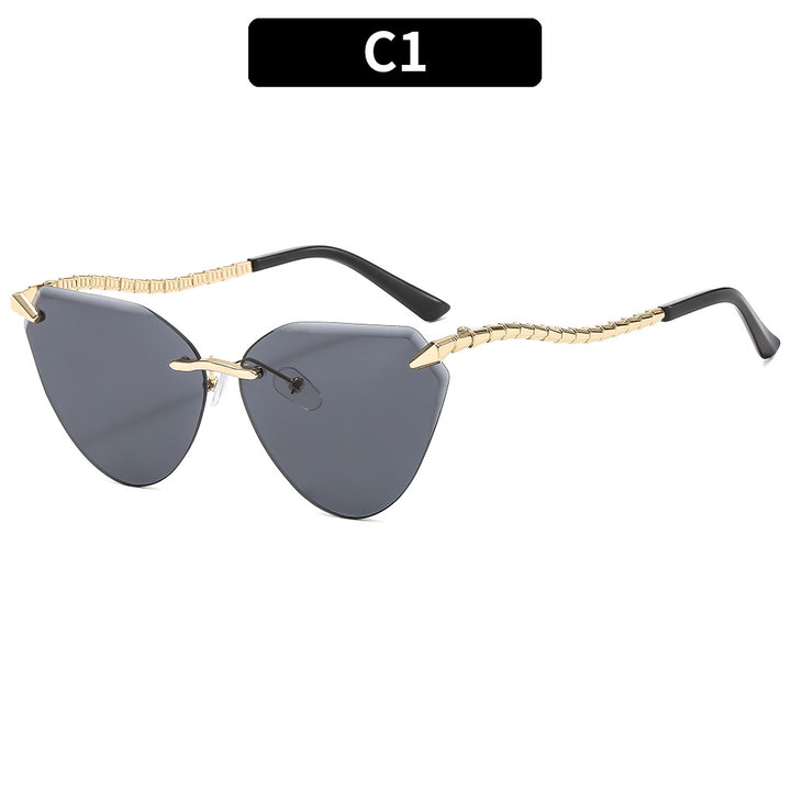 Sculptural Cat-Eye Sunglasses with Decorative Gold Accents
